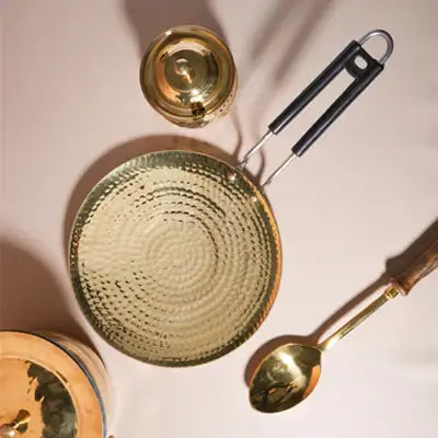 Elegant gold dinnerware set featuring a dish, lid, and spoon—perfect for gifting or enhancing home decor at RoyalStuffs.com.