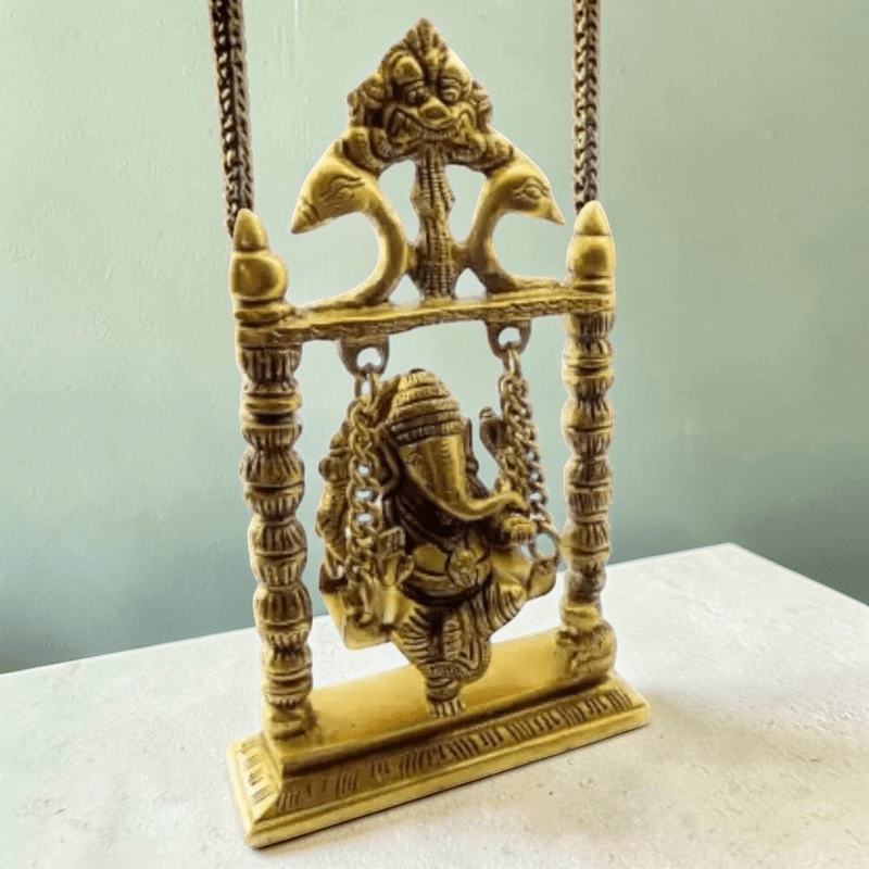 ROYALSTUFFS Ganesha on Swing Statue Idol Brass Height ( 8 Inch) - Royalstuffs.com