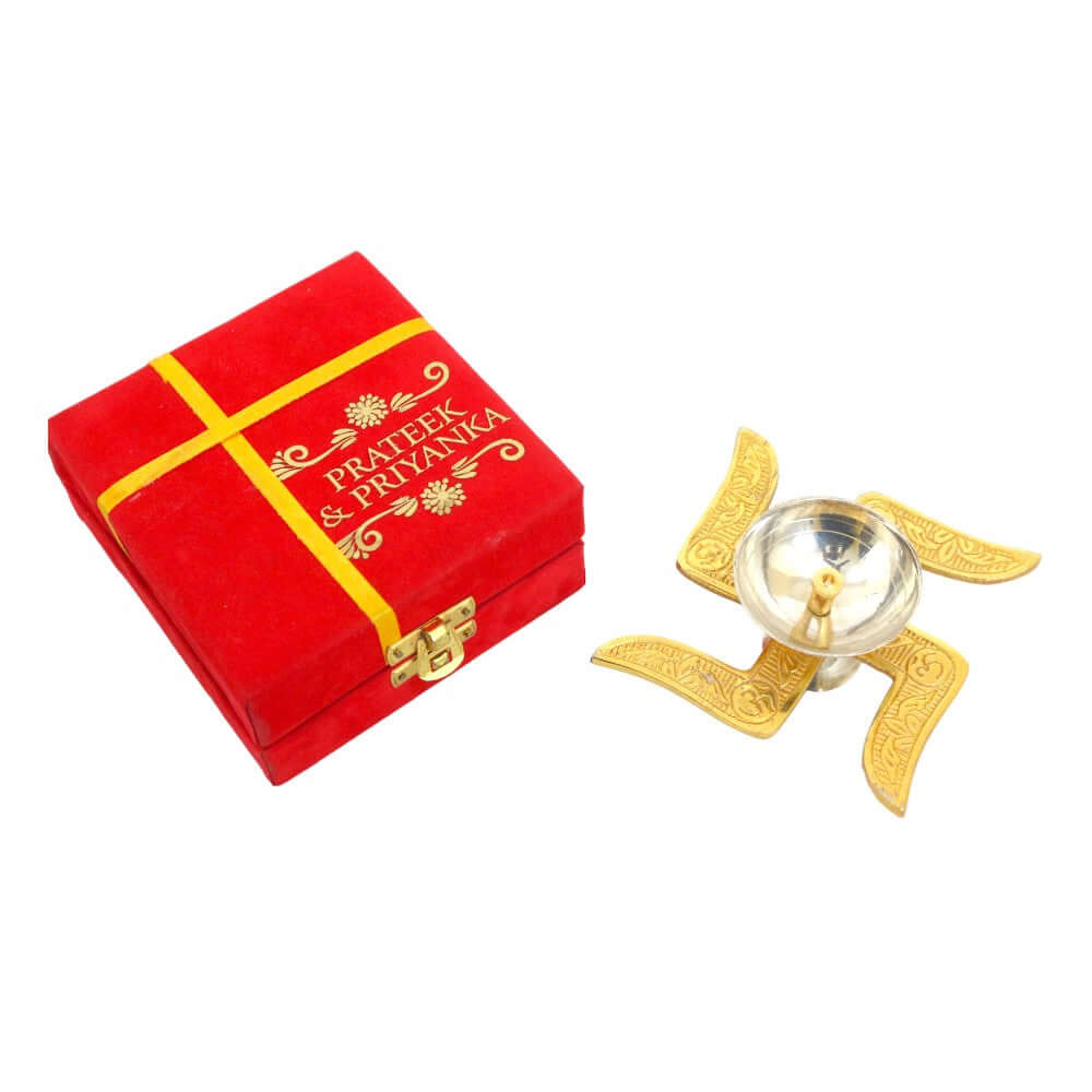 ROYALSTUFFS Akhand Brass Diya - Swastik Design with Red Velvet Box ( Length 4 Inch) - Royalstuffs.com