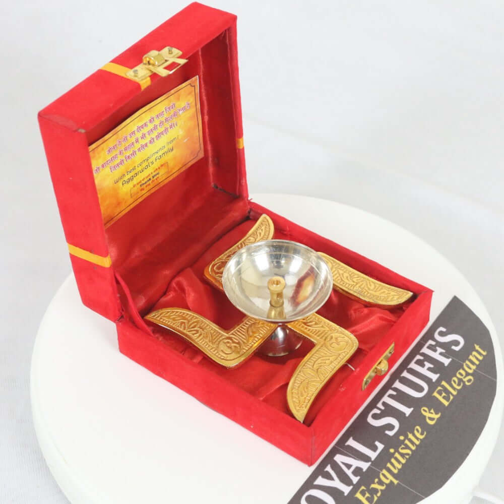 ROYALSTUFFS Akhand Brass Diya - Swastik Design with Red Velvet Box ( Length 4 Inch) - Royalstuffs.com