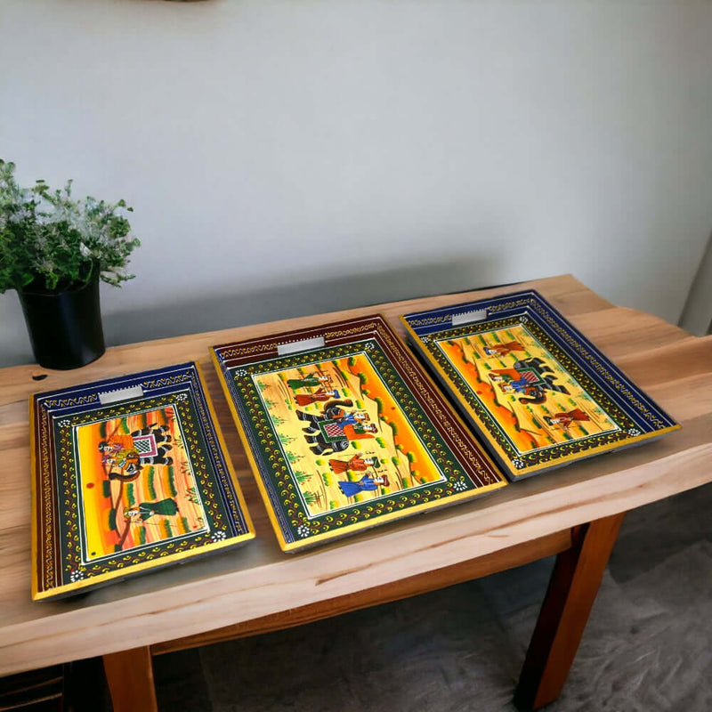 Indian artisan meticulously hand painting traditional designs